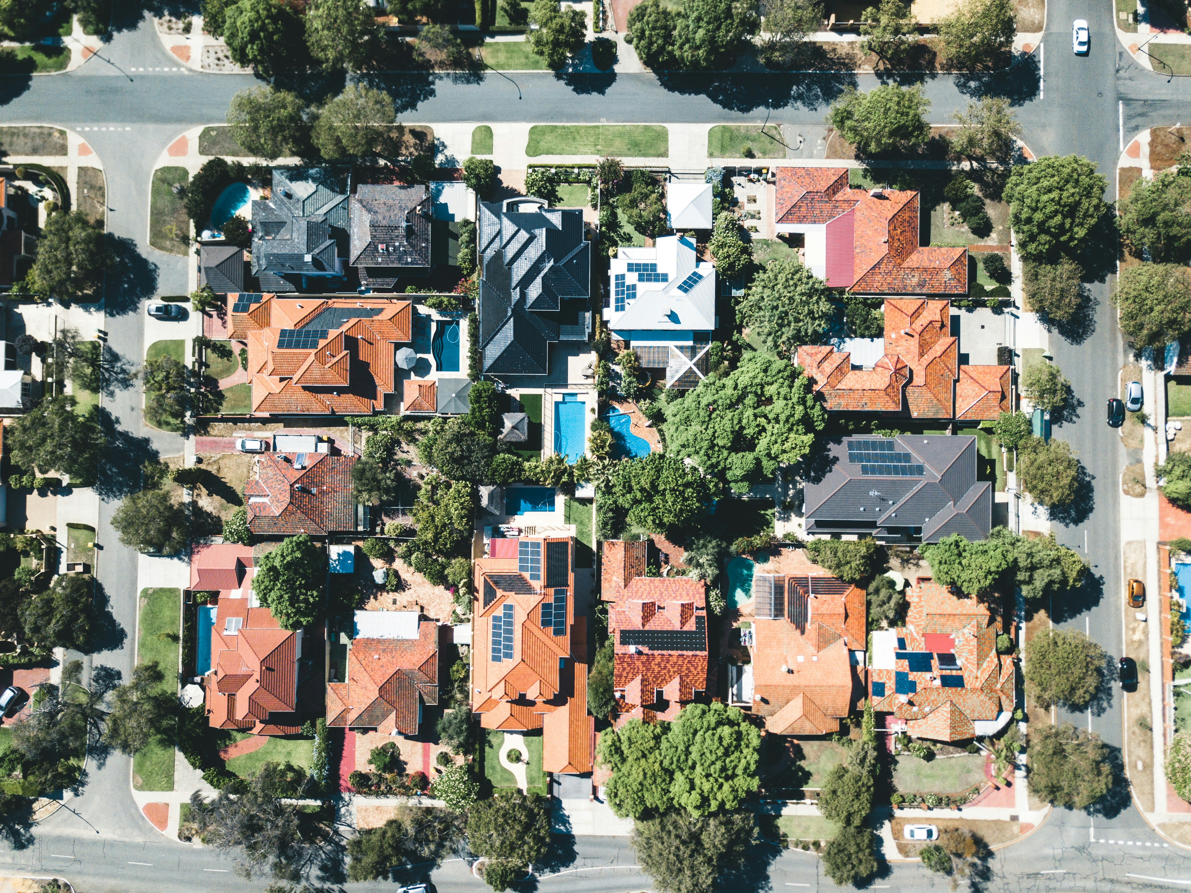 Aerial view of suburban properties demonstrating market intelligence and investment analysis